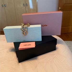 Clutch bag by Cult Gaia, new never worn, beautiful bag with gold chain. $250
